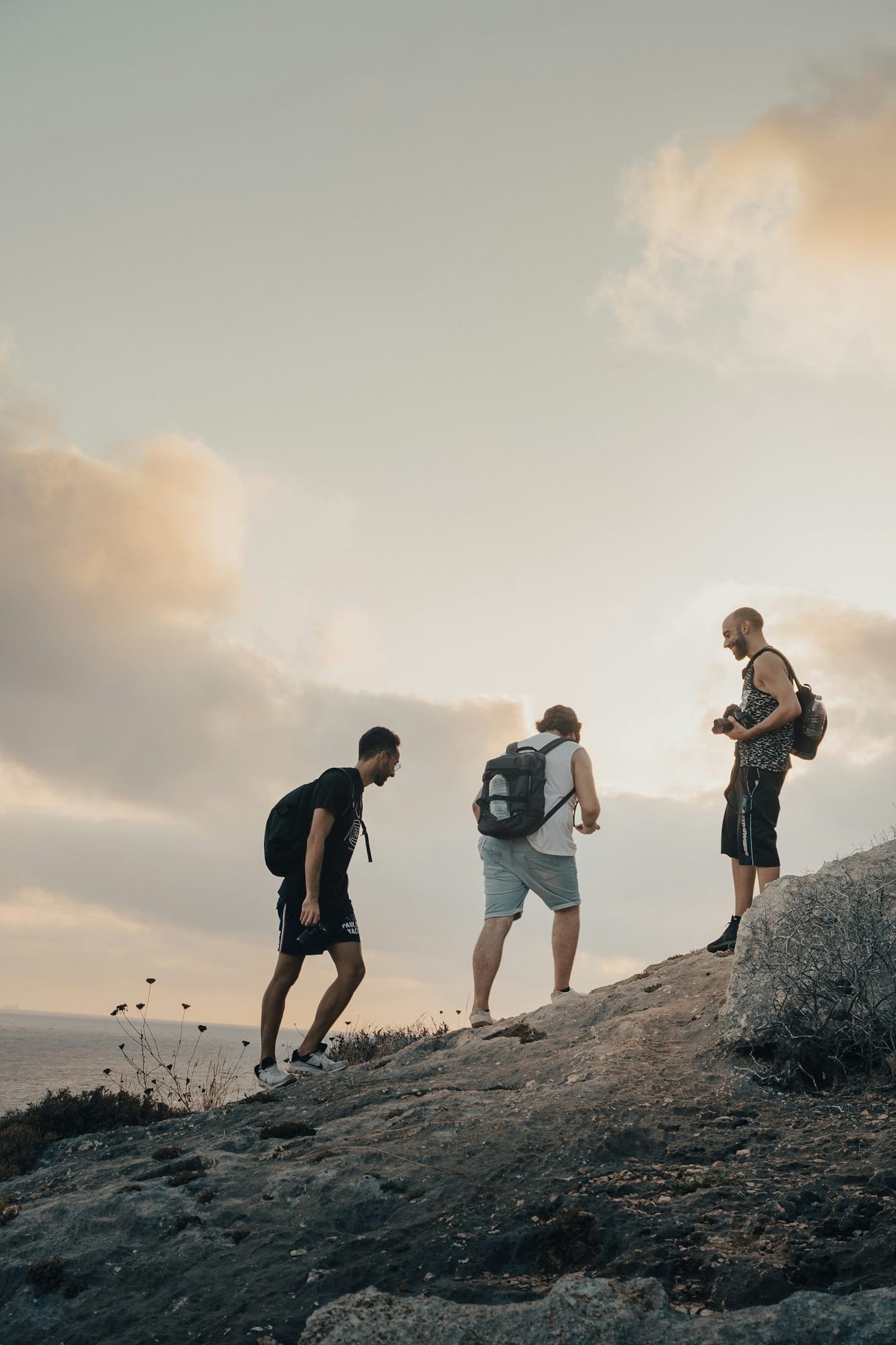 3 young men on sunset hike